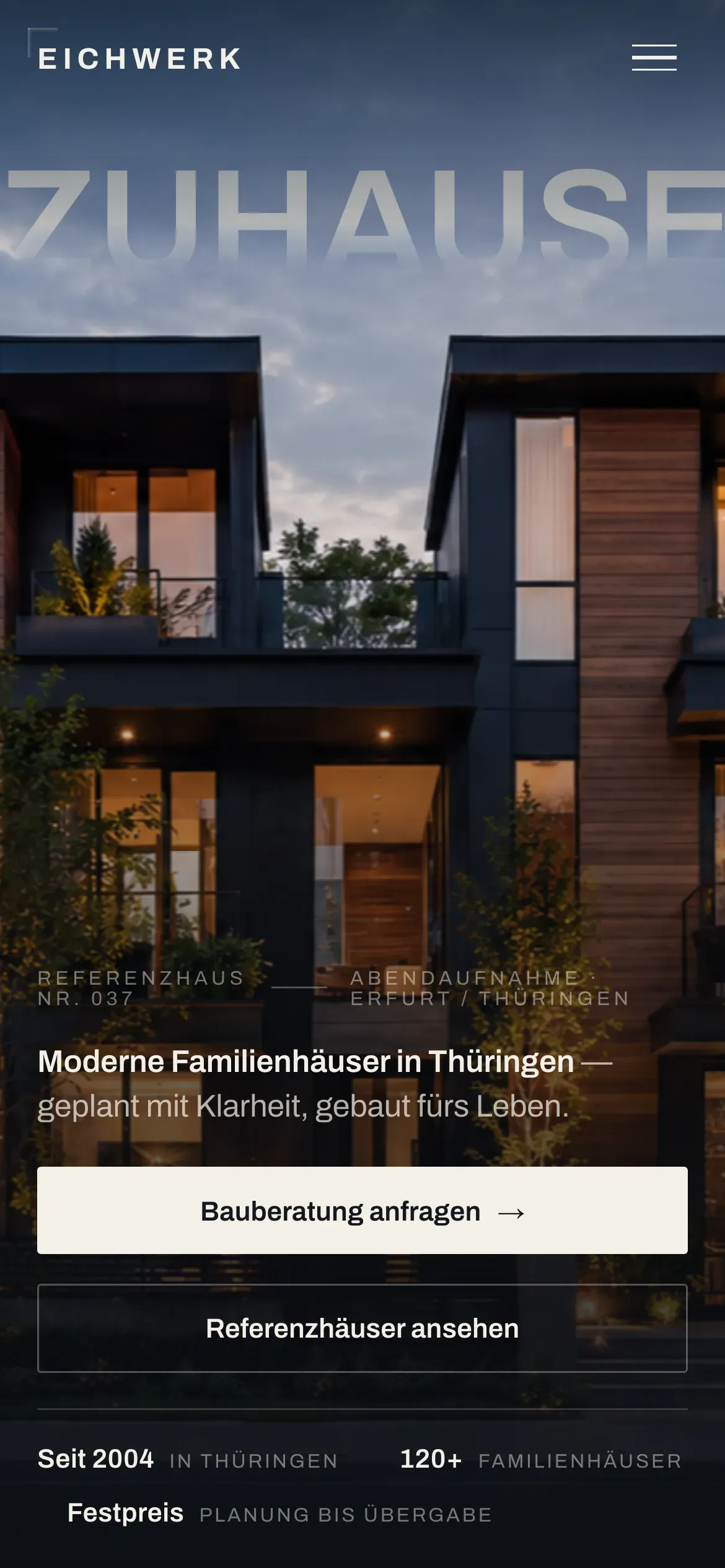 The EICHWERK concept on a phone — the mobile masthead: the wordmark, the large ‘ZUHAUSE’ type and a headline over a blue-hour home, with the primary call-to-action button.